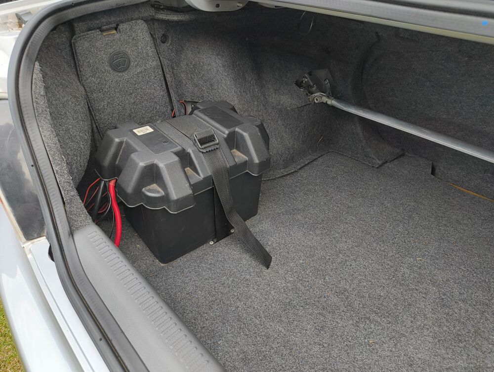 Boot — battery relocated, lining cuts from strut bar install visible