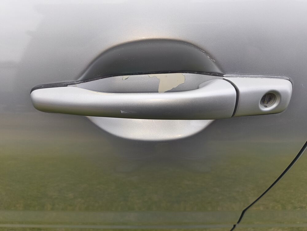 Passenger door handle paint chip