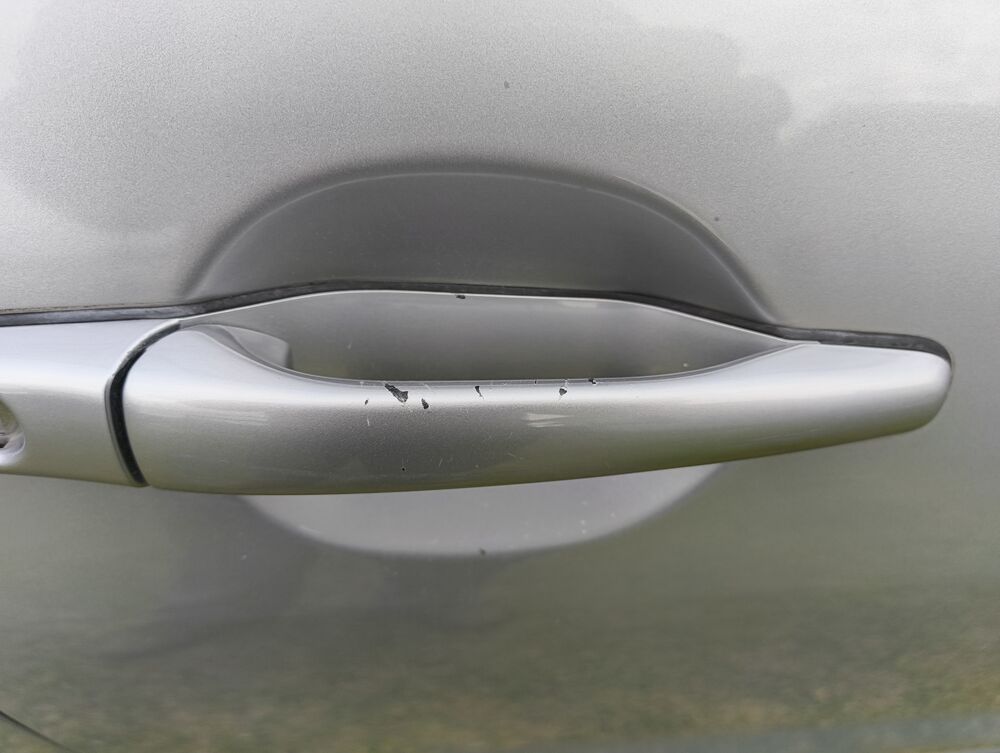 Driver door handle paint flaking