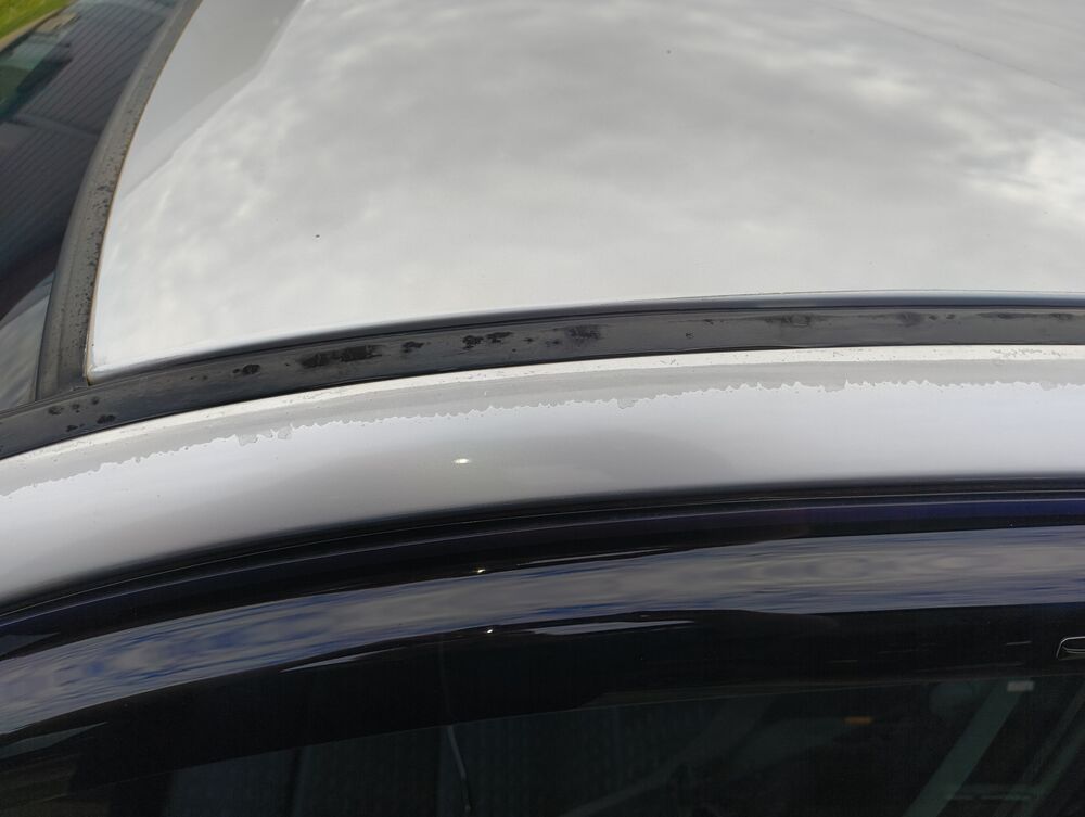 Clear-coat damage along the roof edge