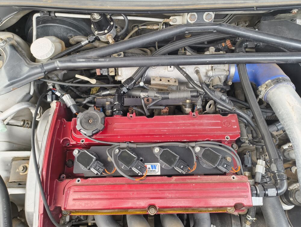 Top-down view of rocker covers and coil packs
