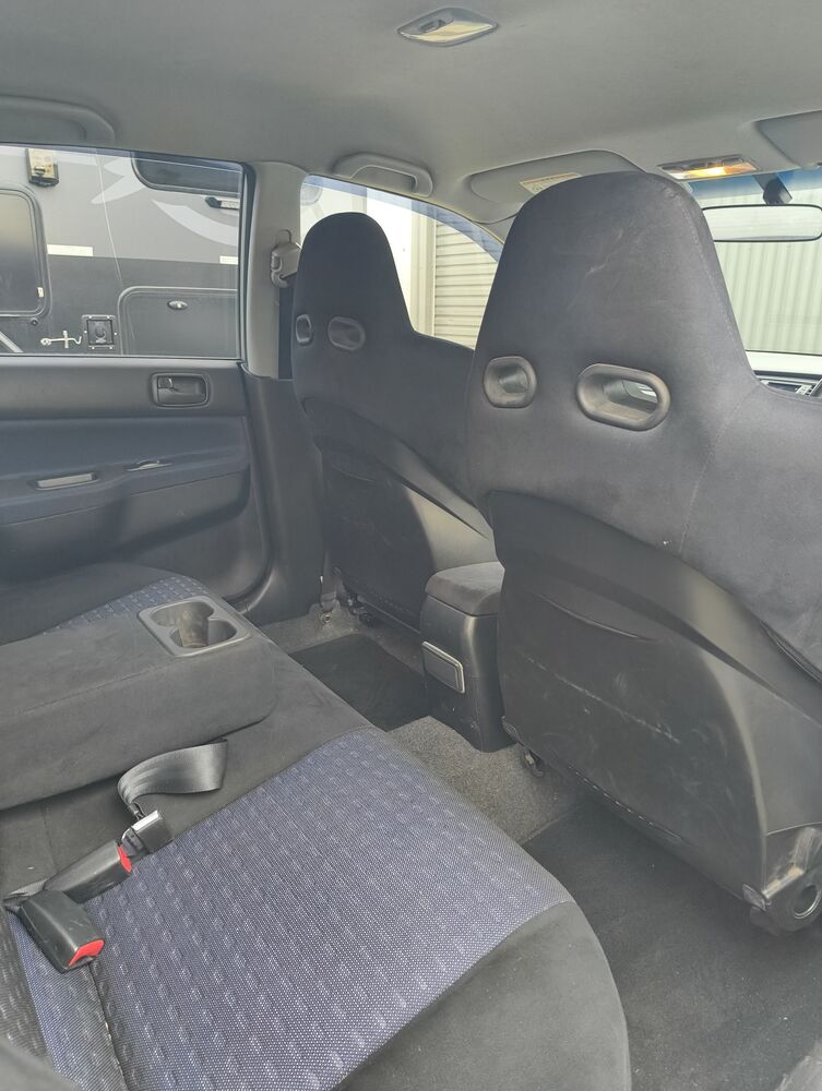 Rear bench with driver Recaro seat back visible