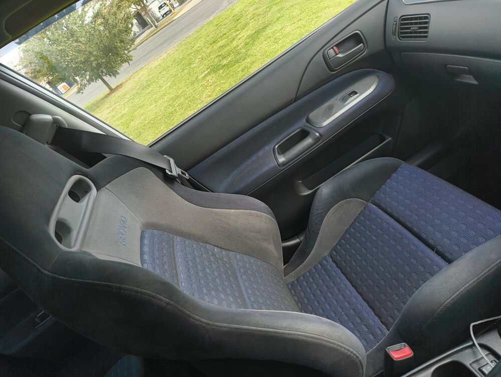 Driver Recaro from the side — bolster condition visible